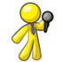 #37724 Clip Art Graphic of a Yellow Guy Character Holding a Microphone by Jester Arts