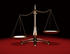 #38133 Clip Art Graphic of an Unbalanced Brass Justice Scale, Symbolizing Inequality, Over A Red And Black Background by Oleksiy Maksymenko