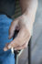 #53729 Royalty-Free Stock Photo of a Hand Holding Cigarette by Maria Bell