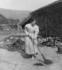 #9409 Picture of a Woman Sweeping By a Spinning Wheel by JVPD