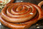 Polish Sausage Cooking On a Grill