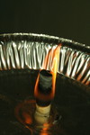 Burning Ear Candle with an Aluminum Pan