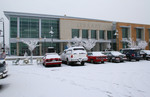 Cars Parked on a Snow Covered Parking Lot Infront of the Jackson County Library