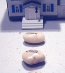 Wishing Stones in Front of a Model House