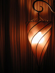 Spiral Lamp in Front of Curtains
