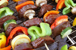 Veggies and Meat on Skewers on a BBQ
