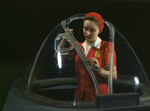 Photo of a Riveter Woman Working on a Nose Section of a Bombardier