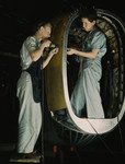 Photo of Riveters, a Man and Woman, Working Together on an Airplane