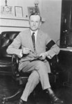 Calvin Coolidge Seated at Desk