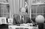 Gerald Ford Working at His Desk, Smoking a Pipe