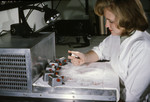 Laboratorian Working with Mosquito Filled Tubes that were used in a Virus Isolation Study