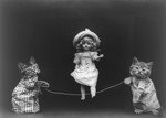 Cats Playing Jump Rope With Doll