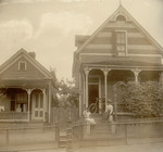 People in Front of Victorian Houses