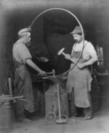 Blacksmiths Making a Wagon Wheel