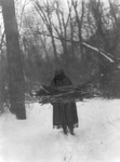 Stock Image: Sioux Woman Carrying Wood