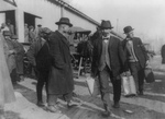 Two Men Carrying Confiscated Liquor During Prohibition