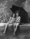 Little Boy and Girl Under Umbrella in Rain