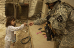 Soldier Giving Candy to a Girl
