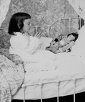 Girl Praying With Her Doll