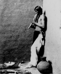 American Indian Playing an Instrument