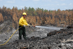 Man Putting Out a Fire
