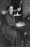 Jane Addams Sitting at a Desk