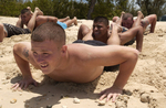 Marine Soldiers Doing Doing Squad Push-ups in Sand