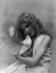 Girl Holding a White Dove