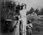 Woman and Daughter Fetching Water From a Well