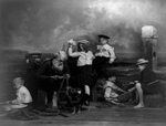 Senior Man and Children on a Pier
