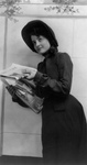 Woman Handing Out Newspapers
