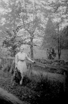Helen Keller By a Fence