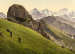 People on a Hillside Near the Swiss Alps Mountains