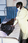 Doctor Examining a Lassa Fever Patient in the Segbwema, Sierra Leone Clinic - 1977
