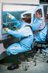 Laboratorians Working Under a Flow Hood Inside a BSL-4 (Bio Safety Lab) Laboratory