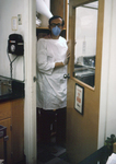 Virologist Entering a Biosafety Level-4 laboratory - 1975