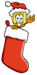 Clip Art Graphic of a Straw Broom Cartoon Character Wearing a Santa Hat Inside a Red Christmas Stocking