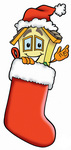 Clip Art Graphic of a Yellow Residential House Cartoon Character Wearing a Santa Hat Inside a Red Christmas Stocking
