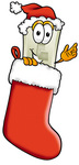Clip Art Graphic of a White Electrical Light Switch Cartoon Character Wearing a Santa Hat Inside a Red Christmas Stocking