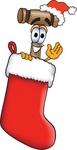 Clip Art Graphic of a Wooden Mallet Cartoon Character Wearing a Santa Hat Inside a Red Christmas Stocking