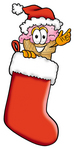 Clip Art Graphic of a Strawberry Ice Cream Cone Cartoon Character Wearing a Santa Hat Inside a Red Christmas Stocking