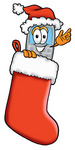 Clip Art Graphic of a Gray Cell Phone Cartoon Character Wearing a Santa Hat Inside a Red Christmas Stocking