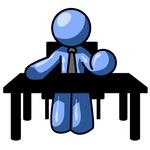 Clip Art Graphic of a Blue Guy Character Sitting At A Desk