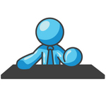 Clip Art Graphic of a Sky Blue Guy Character Behind a Desk