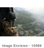 #10589 Picture Of A Soldier Overlooking A City From A Helicopter
