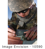 #10590 Picture Of A Soldier Using A Map And Compass