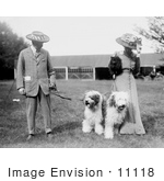 #11118 Picture Of A Couple With Old English Sheepdogs