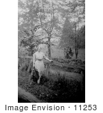 #11253 Picture Of Helen Keller By A Fence