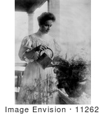 #11262 Picture Of Helen Keller Watering A Plant