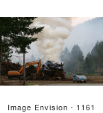 #1161 Picture Of A Controlled Fire Beside A Tractor And Truck